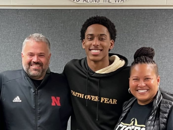 Dawson Merritt with his mother and Nebraska head coach Matt Rhule